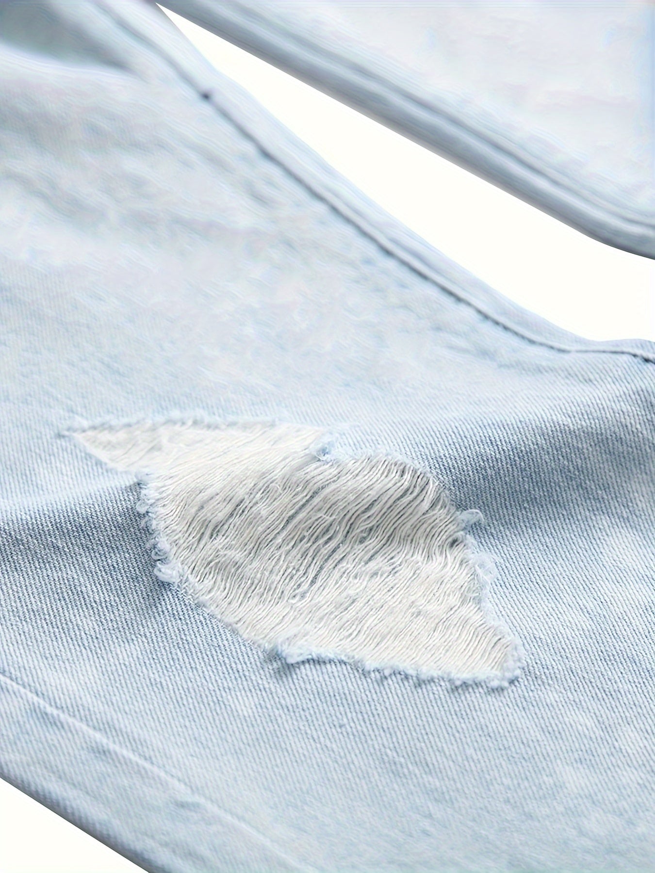 Men wear ripped light blue jeans